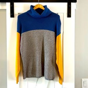 Free people turtleneck sweater. Blue, gray & gold block. Size unknown, M-L.